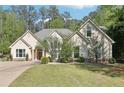 Attractive home with an expansive front yard and a beautifully landscaped garden in a mature setting at 3070 Glad Dale Se Dr, Conyers, GA 30094