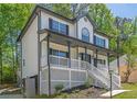 Classic two-story home featuring a covered front porch and manicured landscaping at 1331 Windage Sw Ct, Marietta, GA 30008