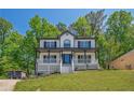 Inviting two-story home with a covered front porch and well-maintained lawn at 1331 Windage Sw Ct, Marietta, GA 30008