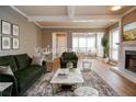 Staged living room with modern furnishings, fireplace and neutral color palette at 407 Coleraine Se, Smyrna, GA 30080