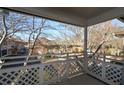 Charming balcony with white lattice railing, perfect for enjoying the peaceful courtyard view at 475 Mount Vernon Ne Hwy # C-220, Sandy Springs, GA 30328