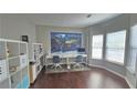 Bright office featuring a map of the world, hardwood floors, and white shelving at 1015 Pebble Creek Trl, Suwanee, GA 30024