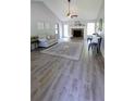 Bright living room with fireplace, vaulted ceiling, hardwood floors, and neutral decor at 1084 Whistle Dr, Austell, GA 30106