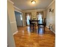 Cozy dining area featuring gleaming hardwood floors and natural light at 128 Brookhaven Ln, Mcdonough, GA 30253