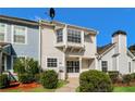 Charming multi-level home with a cozy front porch and manicured landscaping at 5880 Trent Walk Dr, Lithonia, GA 30038