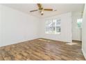 Bright living room with wood flooring and a large window to let natural light in at 5880 Trent Walk Dr, Lithonia, GA 30038