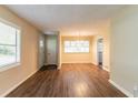 Bright living room with hardwood floors and large windows, creating a warm and inviting atmosphere at 2304 Ousley Ct, Decatur, GA 30032