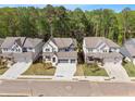 Aerial view of neighborhood featuring modern homes with well-kept lawns at 461 Maypop Ln, Woodstock, GA 30188
