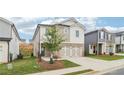 Beautiful two-story house with brick and siding, featuring an attached two-car garage at 2764 Aralynn Way, College Park, GA 30337