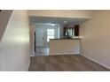 Open-concept living space with a view to the kitchen and exterior access at 3108 Broadleaf Trl, Fairburn, GA 30213