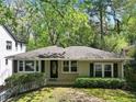 Charming single-story home with fresh landscaping and a manicured lawn in a serene, tree-lined neighborhood at 2585 Acorn Ne Ave, Atlanta, GA 30305