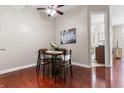 Cozy dining area featuring wood floors, ceiling fan, and adjacent to the kitchen and living spaces at 711 Cosmopolitan Ne Dr # 347, Atlanta, GA 30324