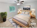 Comfortable bedroom featuring a cozy rug, natural-wood furniture, and a serene ambiance at 245 Adena W Ln, Atlanta, GA 30349