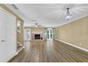 Spacious living room features a fireplace, hardwood floors, neutral paint, and a stylish chandelier at 2008 Falcon Glen Ct, Alpharetta, GA 30022