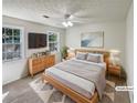 Comfortable bedroom with a ceiling fan, large window, and neutral decor at 2907 Clearbrook Dr, Marietta, GA 30068