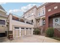 Multi-level home featuring a two car garage and upper deck at 320 Town Center Ave # U206B, Suwanee, GA 30024