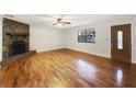 Spacious living room with hardwood floors and stone fireplace at 325 Summertown Dr, Stockbridge, GA 30281