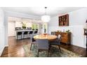 Bright dining room with a hardwood floors connected to the kitchen at 1931 Mceachern Manor Sw Dr, Marietta, GA 30064