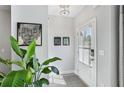 Bright foyer with stylish decor, including a leafy plant and wall art at 2424 Lakeshore Se Ln, Atlanta, GA 30316