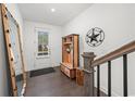 Stylish foyer with a unique hall tree, rustic mirror, and modern finishes at 4068 Allegretto Se Cir # 10, Atlanta, GA 30339