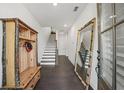 Welcoming foyer with hardwood floors, rustic accents, and staircase at 4068 Allegretto Se Cir # 10, Atlanta, GA 30339