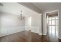 Elegant dining room with hardwood floors, chandelier, and wainscotting at 2656 Staunton Ln, Duluth, GA 30096