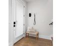 Cozy entryway with light wood bench, coat hooks, and a textured glass front door at 332 Gibson Se St, Atlanta, GA 30316