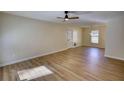 Spacious living room featuring wood flooring and ample natural light at 61 Andrew Rd, Covington, GA 30016