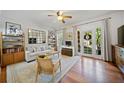 Bright and airy living room with hardwood floors, modern furnishings, and access to the balcony at 794 Frederica Ne St # 2, Atlanta, GA 30306