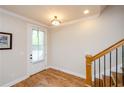 Bright foyer featuring hardwood floors and staircase at 1323 Faircrest Way, Suwanee, GA 30024