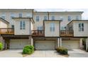 Townhome featuring rear garages and private decks at 1323 Faircrest Way, Suwanee, GA 30024