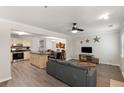 Bright, open living space featuring sleek floors, modern furnishings, and a seamless flow to the kitchen and dining area at 3795 Soapstone Rd, Decatur, GA 30034