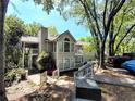 Charming exterior of a multi-story home surrounded by trees at 703 Gettysburg Pl, Atlanta, GA 30350