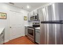 Modern kitchen with stainless steel appliances, white countertops, and gray cabinets at 1101 Juniper Ne St # 415, Atlanta, GA 30309