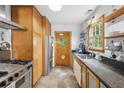Functional kitchen with stainless steel appliances, ample counter space, and a unique round window door at 1015 S Candler St, Decatur, GA 30030