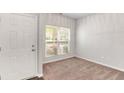 Bright room with neutral carpet, a large window, and white door, perfect for an office or bedroom at 3314 Tiara Cir, Atlanta, GA 30311