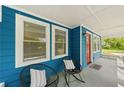 Cozy front porch featuring comfortable seating, perfect for enjoying the neighborhood views at 531 Roy Sw St, Atlanta, GA 30310