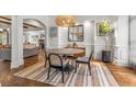 Chic dining room offers a neutral color scheme, modern lighting, and open-concept design at 2537 Thompson Ne Rd, Brookhaven, GA 30319