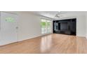 Inviting living room with sleek hardwood floors, built-in storage, and lots of natural light at 2310 Kings Point Dr, Atlanta, GA 30338