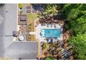 Aerial view of backyard oasis with pool, lounge area, and lush landscaping at 629 Concord Sw Rd, Smyrna, GA 30082