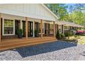 Close up of welcoming front porch with black door and decorative planters at 629 Concord Sw Rd, Smyrna, GA 30082