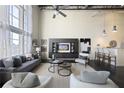 Comfortable living room features large windows, built-in storage, and breakfast bar at 572 Edgewood Ne Ave # 301, Atlanta, GA 30312