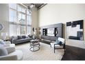 Spacious living area with large windows, built-in media center, and modern decor at 572 Edgewood Ne Ave # 301, Atlanta, GA 30312