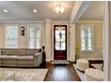 Inviting living room with hardwood floors, natural light, and open layout for comfortable living at 6425 Bellmoore Park Ln, Johns Creek, GA 30097