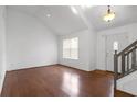 Bright living room with hardwood floors, vaulted ceilings, and natural light at 2565 Feywood Ct, Lithonia, GA 30058