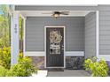 Inviting front entrance with decorative wreath, stone accents, and charming house number at 269 Shoals Bridge Rd, Acworth, GA 30102