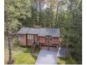 An elevated shot of a cozy home surrounded by lush, dense trees at 4020 Cranwood Dr, Atlanta, GA 30349