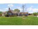 Inviting home with manicured lawn, blue shutters, and a brick and siding exterior at 7425 Twin Creek Ct, Cumming, GA 30041