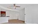 Bright living room with wood-look floors and modern track lighting at 1075 Peachtree Ne Walk # A421, Atlanta, GA 30309