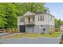 Charming home featuring a quaint front porch and a well-maintained yard at 298 Birch St, Atlanta, GA 30354